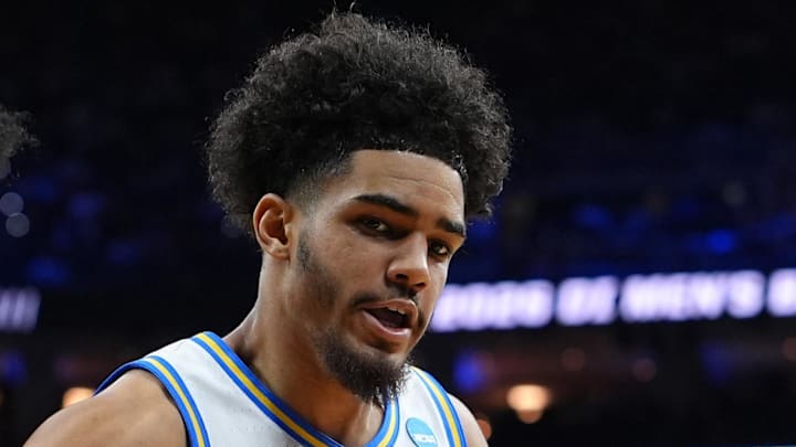 Mar 20, 2026; Philadelphia, PA, USA; UCF Knights forward Jamichael Stillwell (4) grabs a rebound against UCLA Bruins guard Eric Freeny (8) in the second half during a first round game of the men's 2026 NCAA Tournament at Xfinity Mobile Arena. Mandatory Credit: Kyle Ross-Imagn Images Mar 20, 2026; Philadelphia, PA, USA; UCF Knights forward Jamichael Stillwell (4) grabs a rebound against UCLA Bruins guard Eric Freeny (8) in the second half during a first round game of the men's 2026 NCAA Tournament at Xfinity Mobile Arena. Mandatory Credit: Kyle Ross-Imagn Images