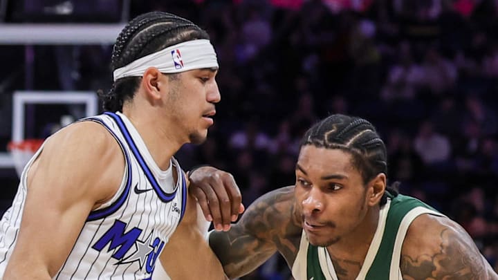 Milwaukee Bucks guard Kevin Porter Jr. drives around Orlando Magic guard Anthony Black.