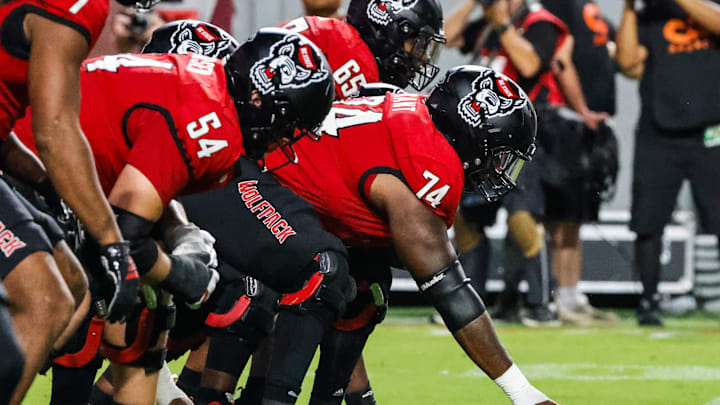 Sep 27, 2025; Raleigh, North Carolina, USA; North Carolina State Wolfpack face off against Virginia Tech Hokies during the first half of the game at Carter-Finley Stadium. Mandatory Credit: Jaylynn Nash-Imagn Images