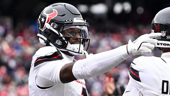 Oct 13, 2024; Foxborough, Massachusetts, USA; Houston Texans wide receiver Stefon Diggs (1) celebrates after scoring a touchdown against the New England Patriots during the second half at Gillette Stadium. Mandatory Credit: Brian Fluharty-Imagn Images