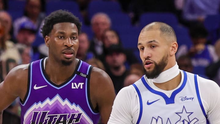Orlando Magic guard Jalen Suggs brings the ball up court in front of Utah Jazz center Jaren Jackson Jr.