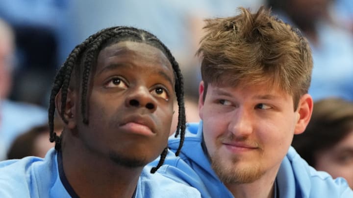 Feb 14, 2026; Chapel Hill, North Carolina, USA; North Carolina Tar Heels forward Caleb Wilson (8) and center Henri Veesaar (13) on the bench in the second half at Dean E. Smith Center. Mandatory Credit: Bob Donnan-Imagn Images