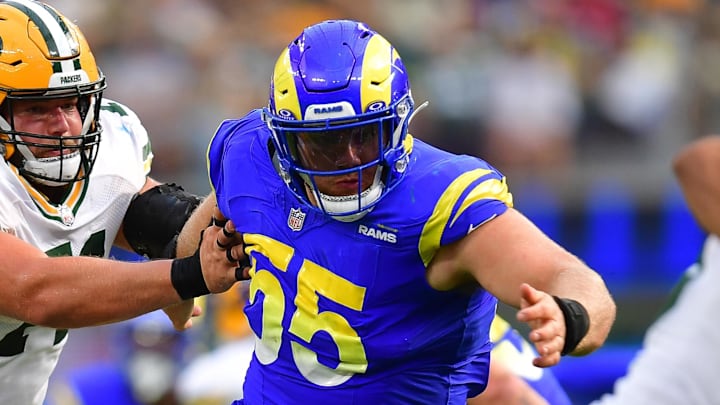 Oct 6, 2024; Inglewood, California, USA; Los Angeles Rams defensive tackle Braden Fiske (55) moves in against Green Bay Packers quarterback Jordan Love (10) as center Josh Myers (71) provides coverageduring the second half at SoFi Stadium. Mandatory Credit: Gary A. Vasquez-Imagn Images