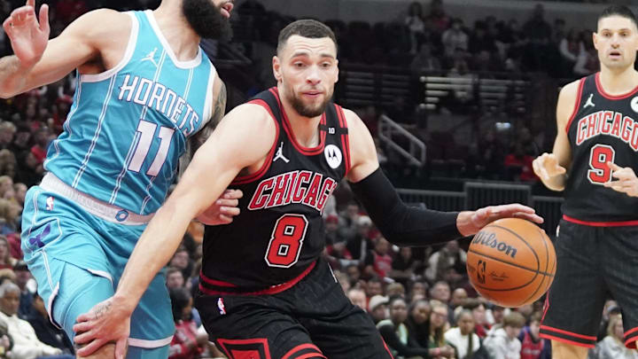 Jan 17, 2025; Chicago, Illinois, USA; Charlotte Hornets forward Cody Martin (11) defends Chicago Bulls guard Zach LaVine (8) during the first quarter at United Center. Mandatory Credit: David Banks-Imagn Images
