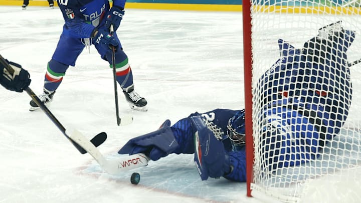 Feb 11, 2026; Milan, Italy;  Damian Clara of Italy and Alex Trivellato of Italy in action with Joel Eriksson Ek of Sweden in men's ice hockey group B play during the Milano Cortina 2026 Olympic Winter Games at Milano Santagiulia Ice Hockey Arena. Mandatory Credit: Geoff Burke-Imagn Images