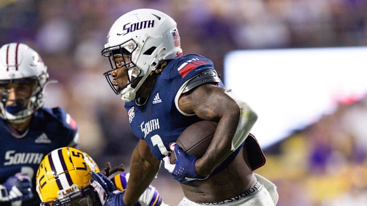 Sep 28, 2024; Baton Rouge, Louisiana, USA;  South Alabama Jaguars wide receiver Jamaal Pritchett (2) runs after a catch against LSU Tigers cornerback Jyaire Brown (17) during the second quarter at Tiger Stadium. Mandatory Credit: Stephen Lew-Imagn Images