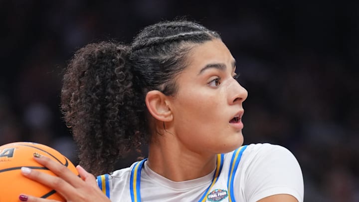 Apr 3, 2026; Phoenix, AZ, USA; UCLA Bruins center Lauren Betts (51) controls the ball against Texas Longhorns guard Jordan Lee (7) during the second half of a semifinal of the Final Four of the women's 2026 NCAA Tournament at Mortgage Matchup Center. Mandatory Credit: Joe Camporeale-Imagn Images Apr 3, 2026; Phoenix, AZ, USA; UCLA Bruins center Lauren Betts (51) controls the ball against Texas Longhorns guard Jordan Lee (7) during the second half of a semifinal of the Final Four of the women's 2026 NCAA Tournament at Mortgage Matchup Center. Mandatory Credit: Joe Camporeale-Imagn Images