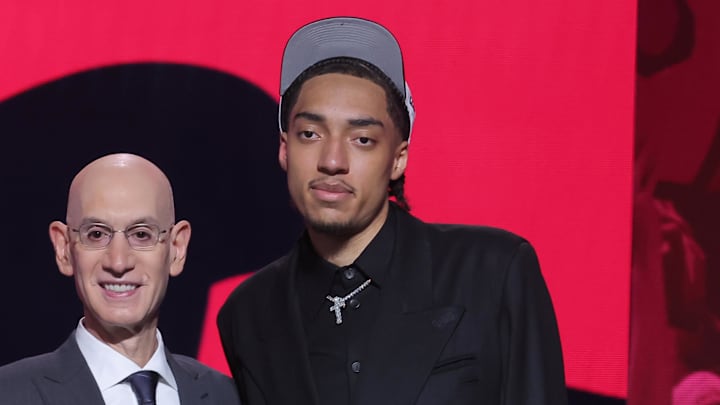 Jun 25, 2025; Brooklyn, NY, USA; Noa Essengue stands with NBA commissioner Adam Silver after being selected as the 12th pick by the Chicago Bulls in the first round of the 2025 NBA Draft at Barclays Center. Mandatory Credit: Brad Penner-Imagn Images Jun 25, 2025; Brooklyn, NY, USA; Noa Essengue stands with NBA commissioner Adam Silver after being selected as the 12th pick by the Chicago Bulls in the first round of the 2025 NBA Draft at Barclays Center. Mandatory Credit: Brad Penner-Imagn Images