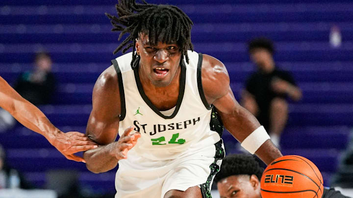 St. Joseph Knights forward Tounde Yessoufou (24) brings the ball up court as Gibbs Gladiators guard Oneal Delancy (5) runs with him during the third quarter of the City of Palms Classic sunshine series championship game at Suncoast Credit Union Arena in Fort Myers, Fla., on Saturday, Dec. 21, 2024.