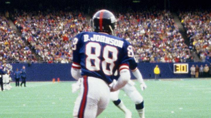 Jan 4, 1987; E. Rutherford, NJ, USA; FILE PHOTO; New York Giants receiver Bobby Johnson catches a touchdown pass as San Francisco 49ers defensive back Tom Holmoe (not pictured)  