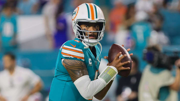Miami Dolphins quarterback Tua Tagovailoa warms up before a game.