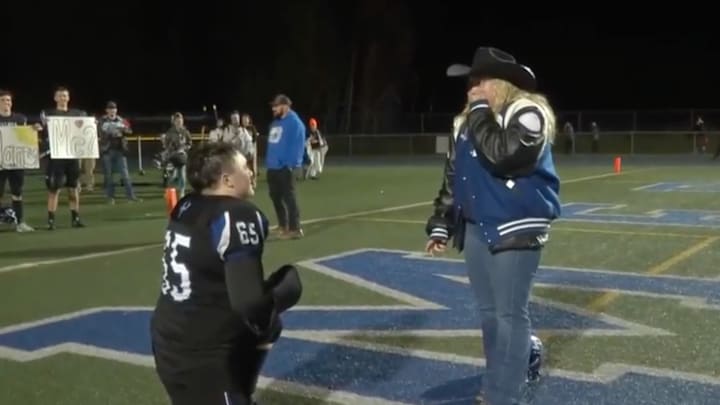 Palmer High School Moose lineman Chandler Coman proposed to longtime girlfriend, Layla Buzzard, following Palmer's win over Chugiak High School. 