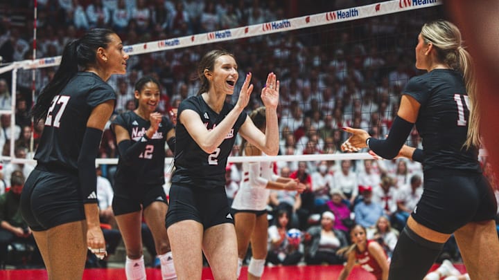 Nebraska volleyball players celebrate a point at Wisconsin.