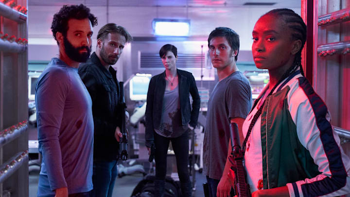 THE OLD GUARD (2020) - (L to R) Marwan Kenzari as Joe, Matthias Schoenaerts as Booker, Charlize Theron as Andy, Luca Marinelli as Nicky, Kiki Layne as Nile. 

Photo Credit: AIMEE SPINKS/NETFLIX ©2020