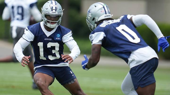 Dallas Cowboys safety Caleb Downs and linebacker DeMarvion Overshown go through a drill during practice at the Ford Center. Dallas Cowboys safety Caleb Downs and linebacker DeMarvion Overshown go through a drill during practice at the Ford Center.