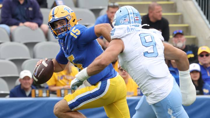 Oct 10, 2026; Pittsburgh, Pennsylvania, USA; Pittsburgh Panthers quarterback Holden Geriner (15) scrambles with the ball against North Carolina Tar Heels defensive lineman Melkart Abou Jaoude (9) during the third quarter at Acrisure Stadium. Mandatory Credit: Charles LeClaire-Imagn Images Oct 10, 2026; Pittsburgh, Pennsylvania, USA; Pittsburgh Panthers quarterback Holden Geriner (15) scrambles with the ball against North Carolina Tar Heels defensive lineman Melkart Abou Jaoude (9) during the third quarter at Acrisure Stadium. Mandatory Credit: Charles LeClaire-Imagn Images