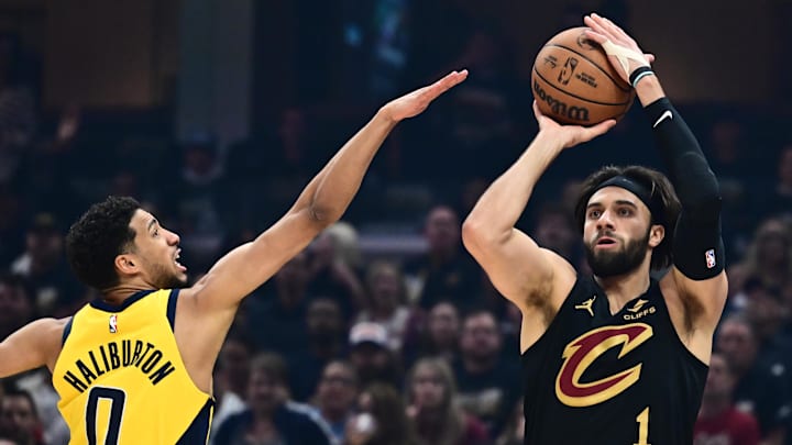 May 13, 2025; Cleveland, Ohio, USA; Cleveland Cavaliers guard Max Strus (1) shoots over the defense of  Indiana Pacers guard Tyrese Haliburton (0) during the first quarter of game five of the second round for the 2025 NBA Playoffs at Rocket Arena. Mandatory Credit: Ken Blaze-Imagn Images