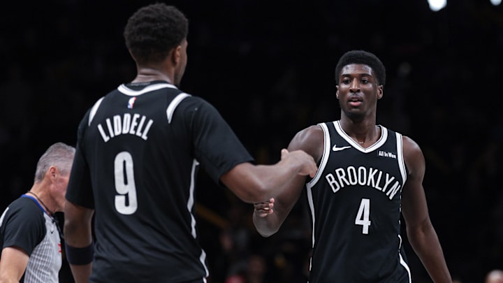 Apr 5, 2026; Brooklyn, New York, USA; Brooklyn Nets guard Drake Powell (4) celebrates with forward E.J. Liddell (9) after defeafting the Washington Wizards at Barclays Center. Mandatory Credit: Vincent Carchietta-Imagn Images