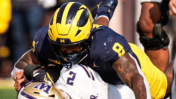 Michigan Wolverines edge Derrick Moore (8) sacks Washington quarterback Demond Williams Jr. (2) 