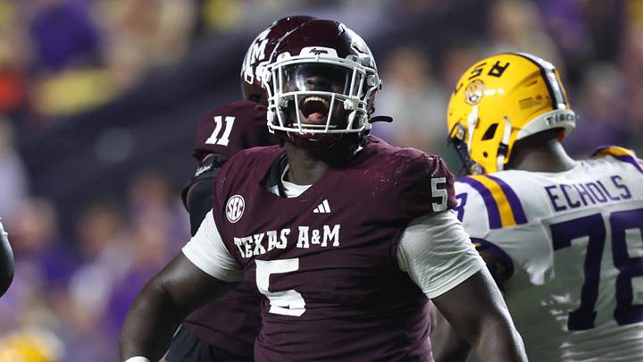 Texas A&M Aggies defensive tackle DJ Hicks (5) celebrates after a play during the second half against the Louisiana State Tigers at Tiger Stadium. Texas A&M Aggies defensive tackle DJ Hicks (5) celebrates after a play during the second half against the Louisiana State Tigers at Tiger Stadium.