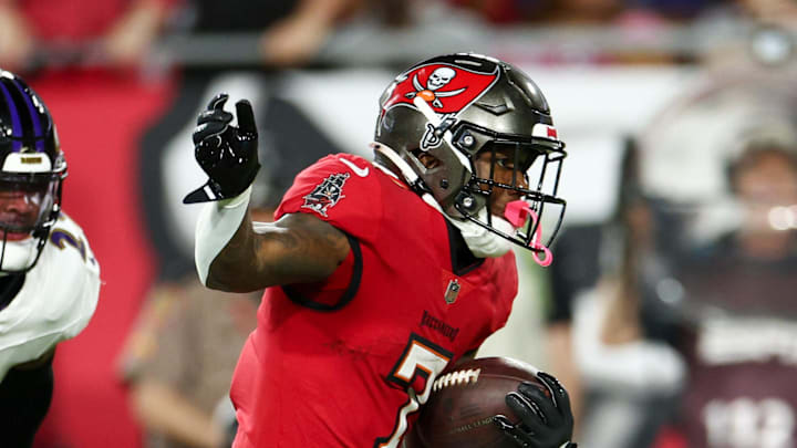 Oct 21, 2024; Tampa, Florida, USA; Tampa Bay Buccaneers running back Bucky Irving (7) runs with the ball against the Baltimore Ravens in the first quarter at Raymond James Stadium. Mandatory Credit: Nathan Ray Seebeck-Imagn Images Oct 21, 2024; Tampa, Florida, USA; Tampa Bay Buccaneers running back Bucky Irving (7) runs with the ball against the Baltimore Ravens in the first quarter at Raymond James Stadium. Mandatory Credit: Nathan Ray Seebeck-Imagn Images