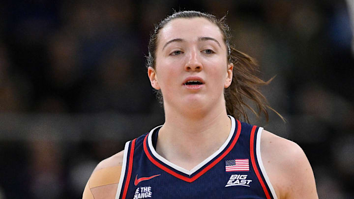 Dec 31, 2025; Providence, Rhode Island, USA; UConn Huskies guard Allie Ziebell (11) dribbles the ball during the first half against the Providence Friars at the Amica Mutual Pavilion.  Mandatory Credit: Eric Canha-Imagn Images