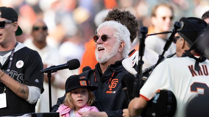 San Francisco, California, USA;  Longtime San Francisco Giants broadcaster Mike Krukow is surrounded by his family as he speaks at his postgame retirement ceremony at Oracle Park.  Mandatory Credit: D. Ross Cameron-Imagn Images