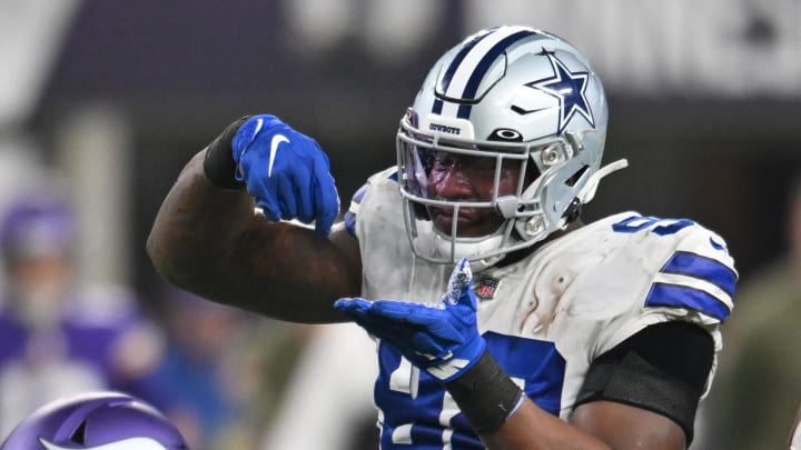 Nov 20, 2022; Minneapolis, Minnesota, USA; Dallas Cowboys defensive end Dorance Armstrong (right) reacts with defensive end DeMarcus Lawrence (left) against the Minnesota Vikings during the third quarter at U.S. Bank Stadium. Mandatory Credit: Jeffrey Becker-USA TODAY Sports