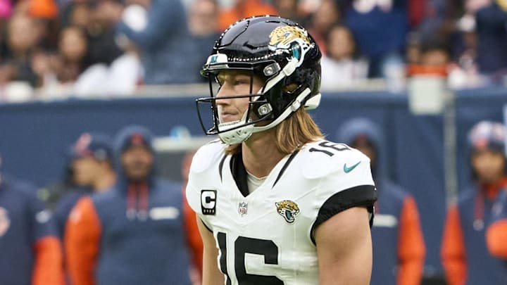 Oct 13, 2024; London, United Kingdom; Jacksonville Jaguars quarterback Trevor Lawrence (16) holds his leg during the second half of an NFL International Series game at Tottenham Hotspur Stadium. Mandatory Credit: Peter van den Berg-Imagn Images