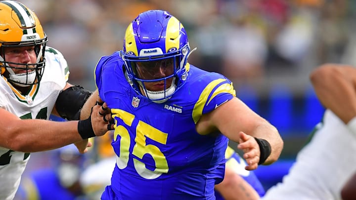Oct 6, 2024; Inglewood, California, USA; Los Angeles Rams defensive tackle Braden Fiske (55) moves in against Green Bay Packers quarterback Jordan Love (10) as center Josh Myers (71) provides coverageduring the second half at SoFi Stadium. Mandatory Credit: Gary A. Vasquez-Imagn Images