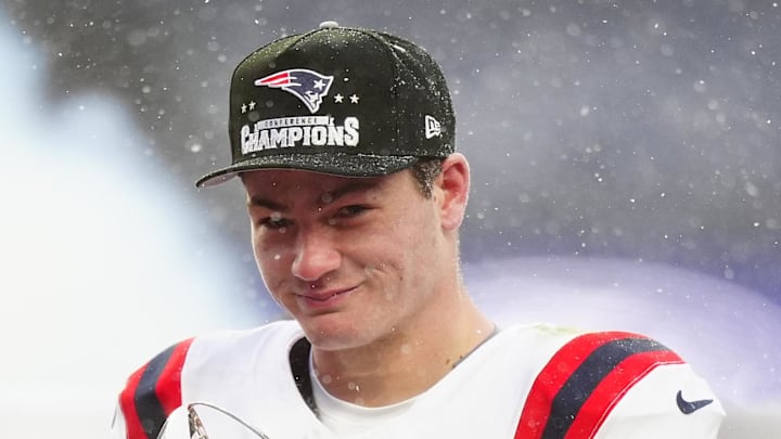Jan 25, 2026; Denver, CO, USA; New England Patriots quarterback Drake Maye (10) holds the AFC Championship trophy while speaking to the media after defeating the Denver Broncos in the 2026 AFC Championship Game at Empower Field at Mile High. Mandatory Credit: Ron Chenoy-Imagn Images