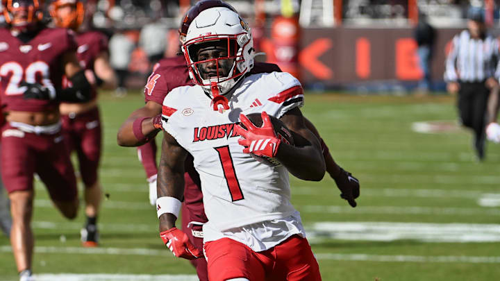 Nov 1, 2025; Blacksburg, Virginia, USA;  Louisville Cardinals running back Isaac Brown (1) runs the ball for a touchdown against the Virginia Tech Hokies during the first quarter at Lane Stadium. Mandatory Credit: Brian Bishop-Imagn Images