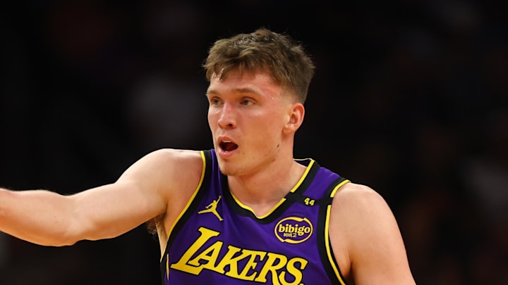 Oct 28, 2024; Phoenix, Arizona, USA; Los Angeles Lakers guard Dalton Knecht (4) against the Phoenix Suns at Footprint Center. Mandatory Credit: Mark J. Rebilas-Imagn Images