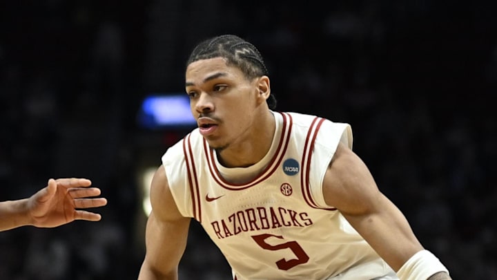 Mar 21, 2026; Portland, OR, USA; Arkansas Razorbacks guard Darius Acuff Jr. (5) drives against High Point Panthers guard Rob Martin (3) in the second half during a second round game of the men's 2026 NCAA Tournament at Moda Center. Mandatory Credit: Troy Wayrynen-Imagn Images