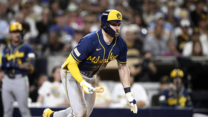 Oct 7, 2026; San Diego, California, USA;  Milwaukee Brewers center fielder Garrett Mitchell (5) runs to first after hitting a triple during the fifth inning against the San Diego Padres in game four of the NLDS for the 2026 MLB Playoffs at Petco Park.  Mandatory Credit: Denis Poroy-Imagn Images