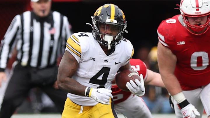 Nov 24, 2023; Lincoln, Nebraska, USA; Iowa Hawkeyes running back Leshon Williams (4) runs the football against the Nebraska Cornhuskers at Memorial Stadium. Mandatory Credit: Reese Strickland-Imagn Images Nov 24, 2023; Lincoln, Nebraska, USA; Iowa Hawkeyes running back Leshon Williams (4) runs the football against the Nebraska Cornhuskers at Memorial Stadium. Mandatory Credit: Reese Strickland-Imagn Images