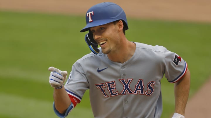 Jun 12, 2025; Minneapolis, Minnesota, USA; Texas Rangers center fielder Evan Carter (32) celebrates his solo home run against the Minnesota Twins in the fifth inning at Target Field