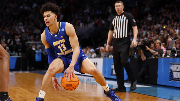 Mar 17, 2023; Denver, CO, USA; UC Santa Barbara Gauchos guard Ajay Mitchell (13) handles the ball against Baylor Bears during the first half in the first round of the 2023 NCAA men s basketball tournament at Ball Arena. Mandatory Credit: Michael Ciaglo-USA TODAY Sports Mar 17, 2023; Denver, CO, USA; UC Santa Barbara Gauchos guard Ajay Mitchell (13) handles the ball against Baylor Bears during the first half in the first round of the 2023 NCAA men s basketball tournament at Ball Arena. Mandatory Credit: Michael Ciaglo-USA TODAY Sports