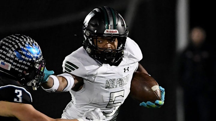 Decatur's Gavin Solito (3) tackles Milford Mill's Damon Ferguson (5) Friday, Nov. 24, 2023, in the 2A State Semifinal in Berlin, Maryland. Decatur defeated Milford Mill 35-34. Decatur's Gavin Solito (3) tackles Milford Mill's Damon Ferguson (5) Friday, Nov. 24, 2023, in the 2A State Semifinal in Berlin, Maryland. Decatur defeated Milford Mill 35-34.