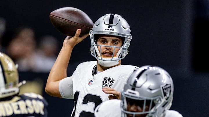 Dec 29, 2024; New Orleans, Louisiana, USA; Las Vegas Raiders quarterback Aidan O'Connell (12) passes against New Orleans Saints defensive end Carl Granderson (96) during the first half at Caesars Superdome. Mandatory Credit: Stephen Lew-Imagn Images Dec 29, 2024; New Orleans, Louisiana, USA; Las Vegas Raiders quarterback Aidan O'Connell (12) passes against New Orleans Saints defensive end Carl Granderson (96) during the first half at Caesars Superdome. Mandatory Credit: Stephen Lew-Imagn Images