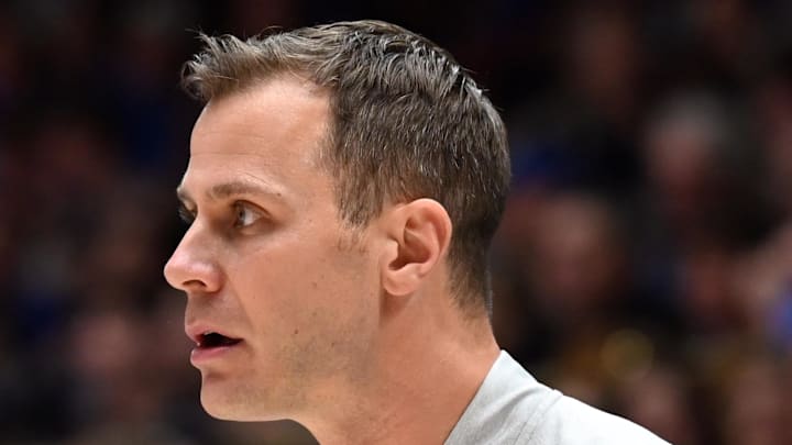 Jan 10, 2026; Durham, North Carolina, USA; Duke Blue Devils forward Cameron Boozer (12) talks to head coach Jon Scheyer during the first half against the Southern Methodist Mustangs at Cameron Indoor Stadium. Mandatory Credit: Rob Kinnan-Imagn Images