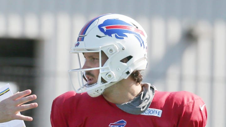 Bills quarterback Josh Allen talks with offensive coordinator Joe Brady.