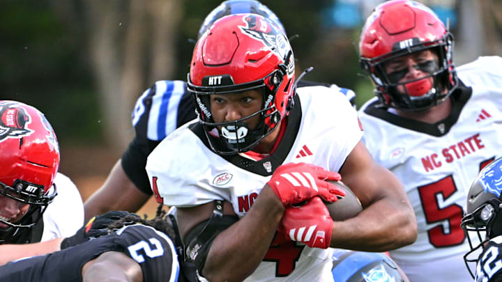 Sep 20, 2025; Durham, North Carolina, USA; North Carolina State Wolfpack running back Jayden Scott (4) runs the ball during the first quarter against the Duke Blue Devils at Wallace Wade Stadium. Mandatory Credit: Zachary Taft-Imagn Images Sep 20, 2025; Durham, North Carolina, USA; North Carolina State Wolfpack running back Jayden Scott (4) runs the ball during the first quarter against the Duke Blue Devils at Wallace Wade Stadium. Mandatory Credit: Zachary Taft-Imagn Images