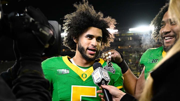 Dec 20, 2025; Eugene, OR, USA;  Oregon Ducks quarterback Dante Moore (5) is interviewed after the game against the James Madison Dukes at Autzen Stadium. Mandatory Credit: Troy Wayrynen-Imagn Images