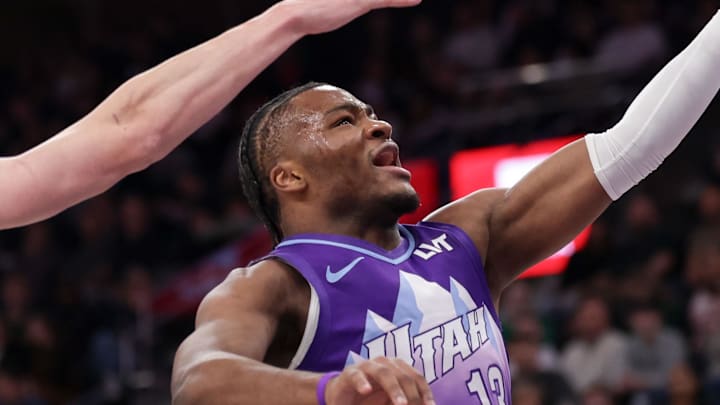 Mar 17, 2025; Salt Lake City, Utah, USA;  Utah Jazz guard Isaiah Collier (13) gets past Chicago Bulls guard Kevin Huerter (13) and to the basket during the first quarter at Delta Center. Mandatory Credit: Chris Nicoll-Imagn Images