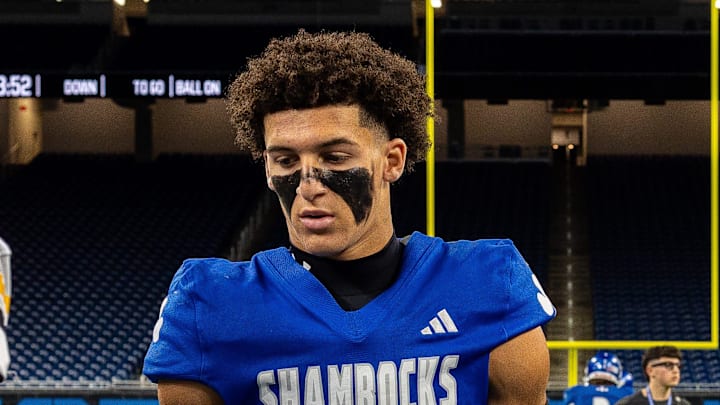 Detroit Catholic Central wide receiver Samson Gash (5) and teammate Hunter Stokes (86) shake hands with Detroit King players before the start of the 2025 Prep Bowl at Ford Field in Detroit on Saturday, Oct. 25, 2025.