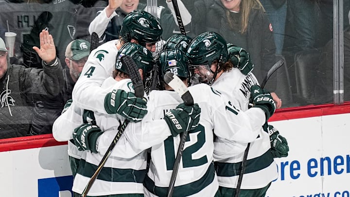 Michigan State players celebrate a goal against Michigan during the second period of Duel in the D at Little Caesars Arena in Detroit on Saturday, February 7, 2026.