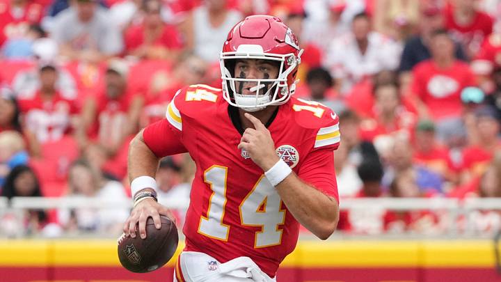Aug 15, 2026; Kansas City, Missouri, USA; Kansas City Chiefs quarterback Garrett Nussmeier (14) scrambles in the backfield against the Los Angeles Rams during the first half of the pre season at Arrowhead Stadium. Mandatory Credit: Denny Medley-Imagn Images