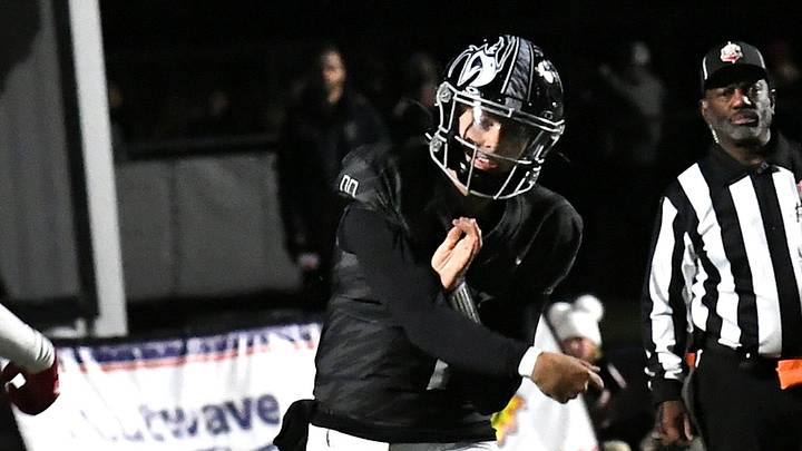 Quarterback Nile Knutson sees a completed pass for a Lakota East first down at the Lakota East vs. Lakota West Greater Miami Conference football game, Oct. 24, 2025.