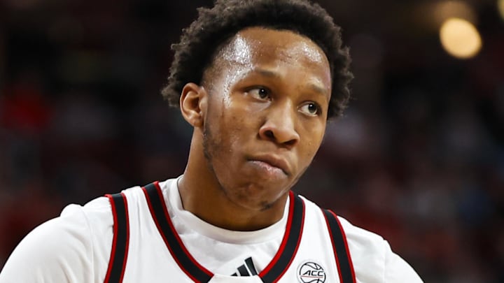 Jan 27, 2026; Raleigh, North Carolina, USA; NC State Wolfpack guard Quadir Copeland (11) reacts to his dunk during the first half of the game against the Syracuse Orange at Lenovo Center. Mandatory Credit: Jaylynn Nash-Imagn Images